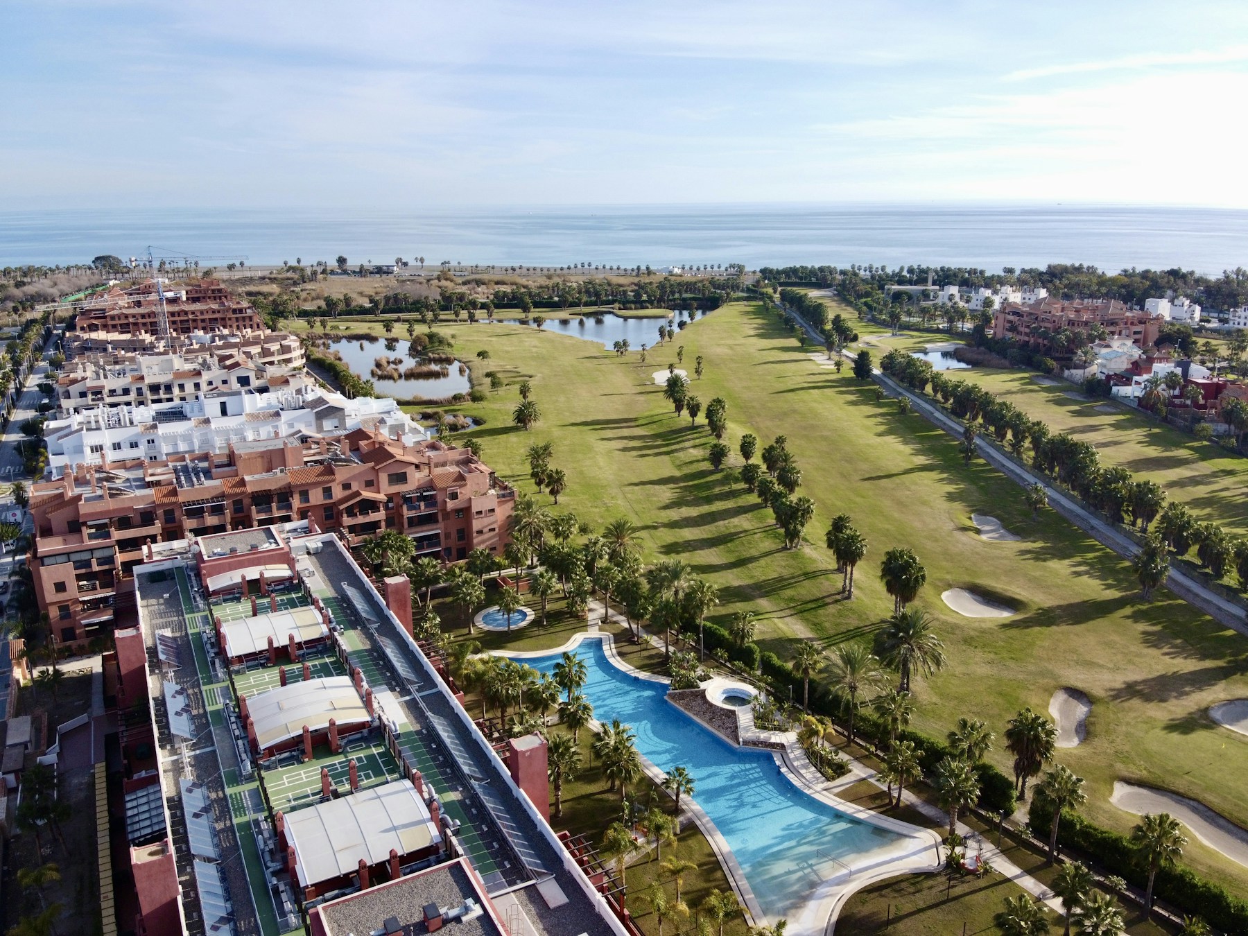 A coastal golf resort viewed from above