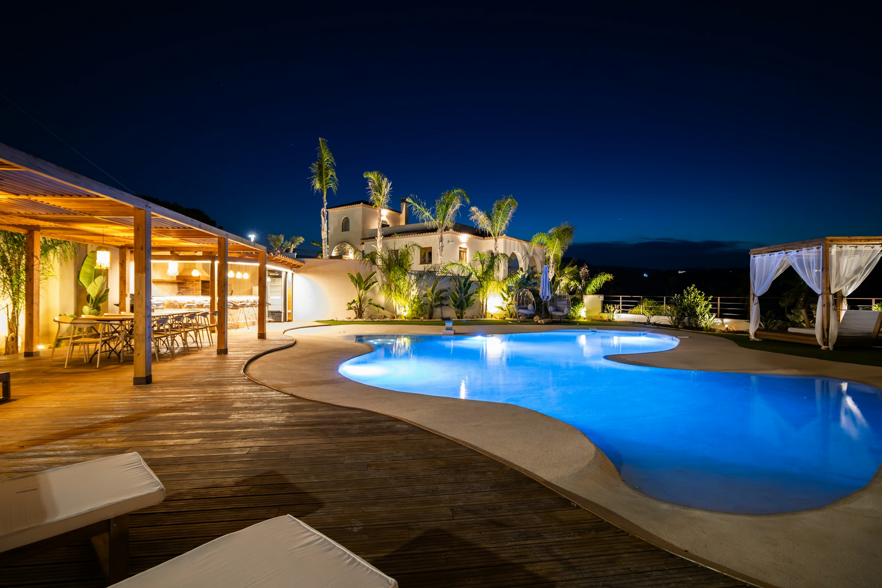 A refined resort glowing at night